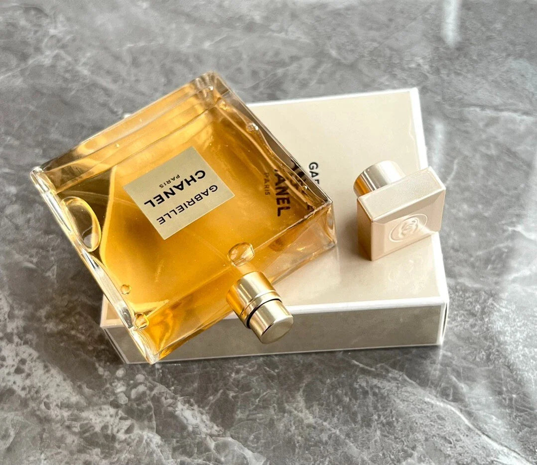 Chanel perfume bottle and packaging on a gray marble surface