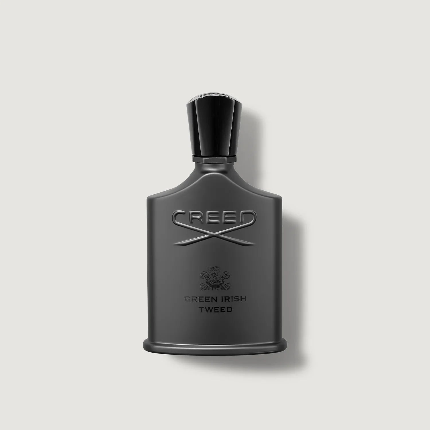 Creed Green Irish Tweed perfume bottle on a light gray background
