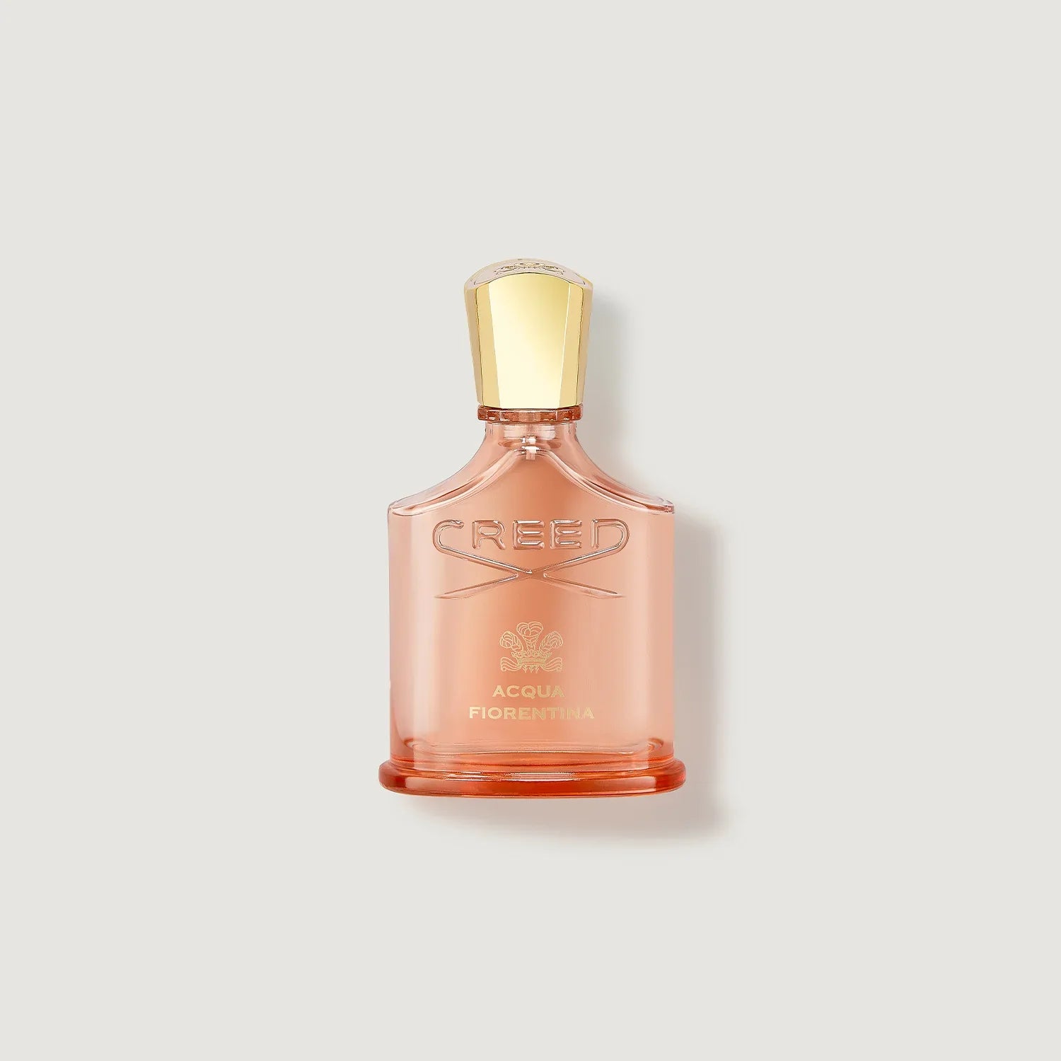 Creed perfume bottle on a light beige background
