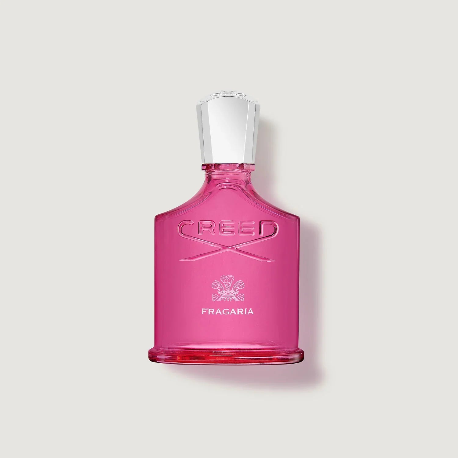 Pink Creed Fragaria perfume bottle on a light gray background